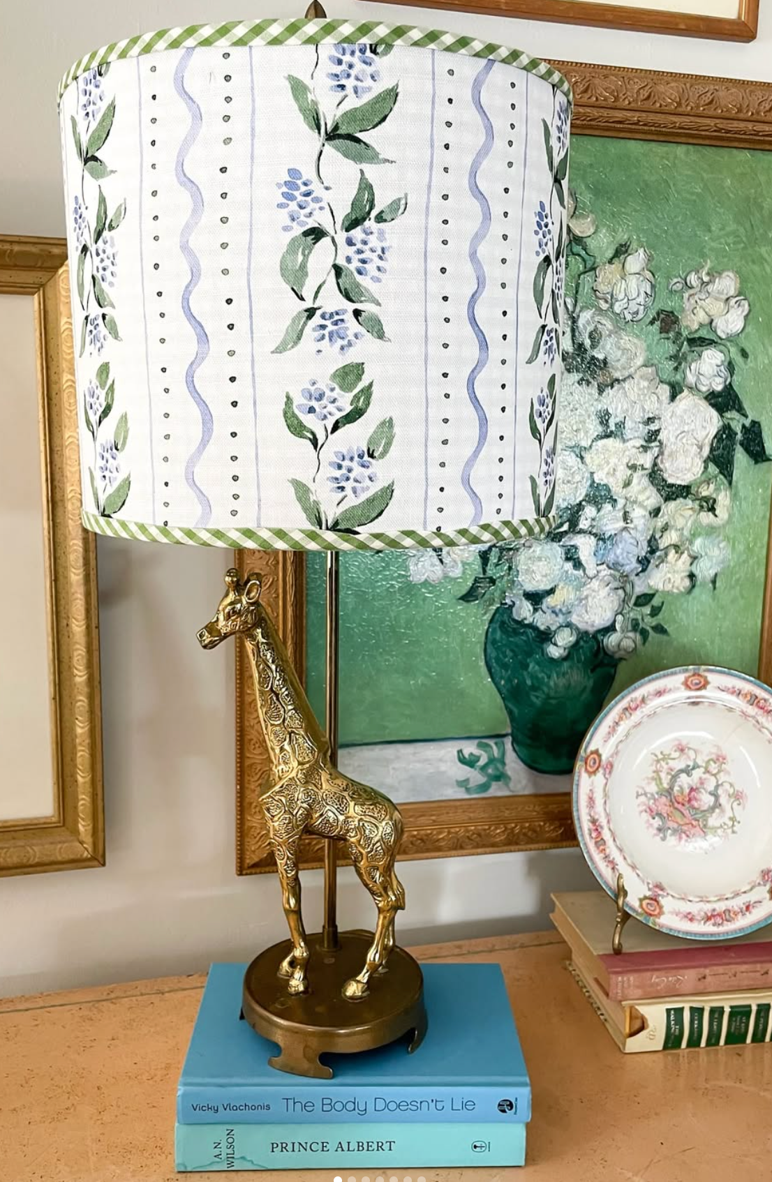 Decorative lampshade with floral pattern in green and blue.