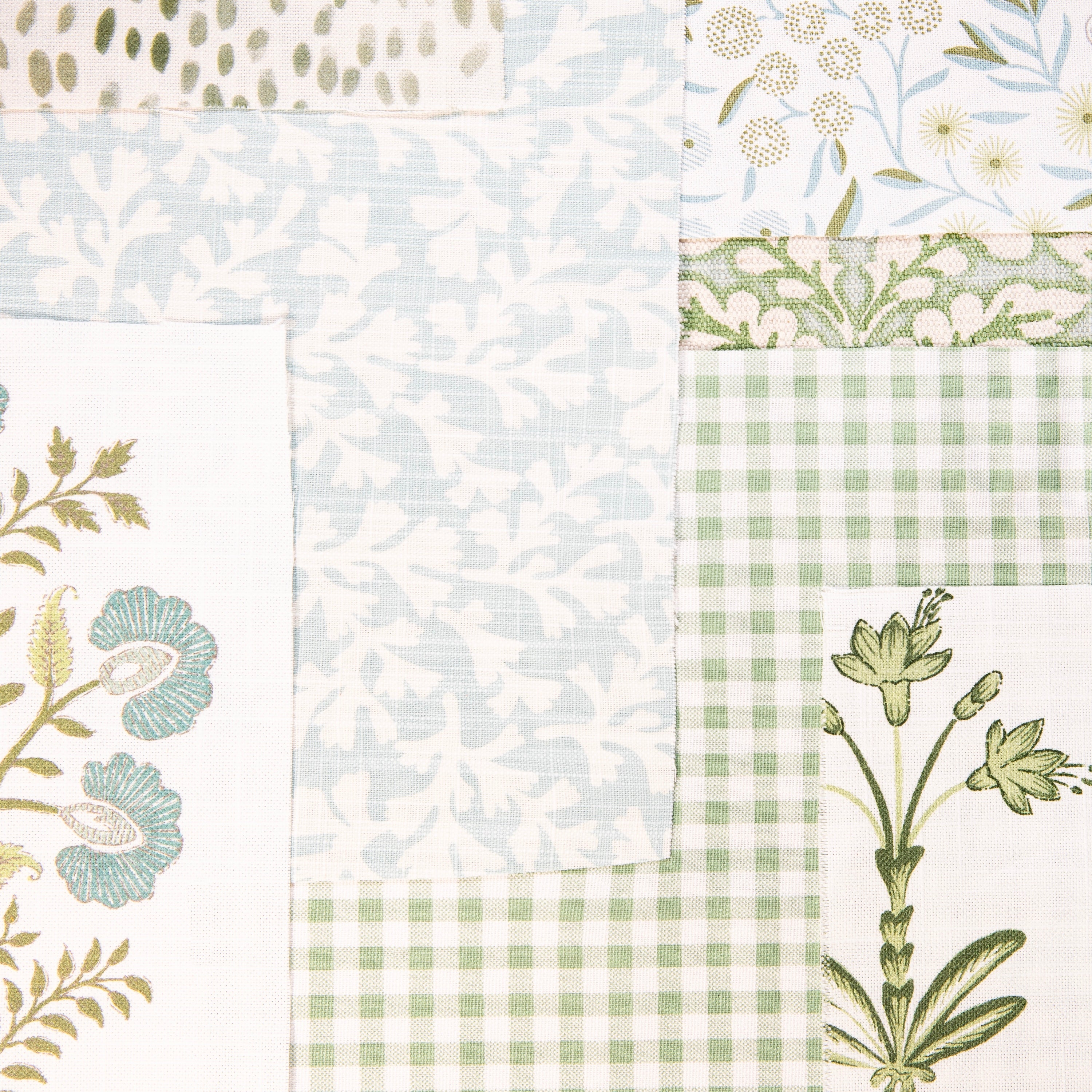 An assortment of green and blue fabrics